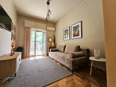 a living room with a couch and a table at EL Prestige Apartment - Athens Town in Athens