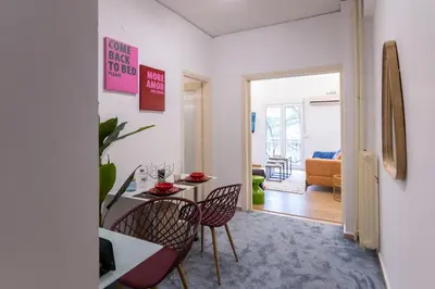 a living room with a table and chairs at Prime and Cosy 1bedroom Hop to Acropolis in Athens