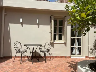 a patio with a table and two chairs at One-bedroom Suite - Themelio Suites - Acropolis Area in Athens