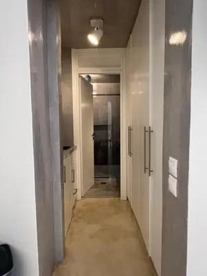 an empty hallway with a hallway leading to a bathroom at One-bedroom Suite - Themelio Suites - Acropolis Area in Athens