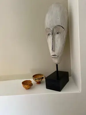 aumedumed mask on a shelf with two bowls at One-bedroom Suite - Themelio Suites - Acropolis Area in Athens