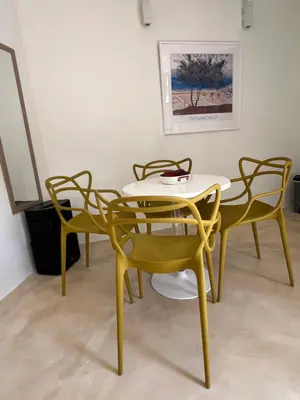 a yellow table and chairs in a room at One-bedroom Suite - Themelio Suites - Acropolis Area in Athens