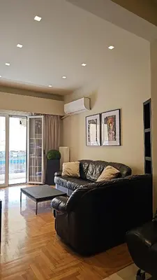 a living room with a couch and a table at J&G Luxury Apartment - Athens Town in Athens