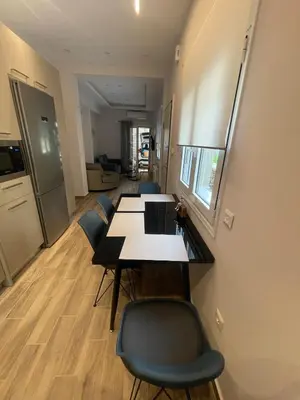 a dining room with a table and chairs at Mimoza in Athens