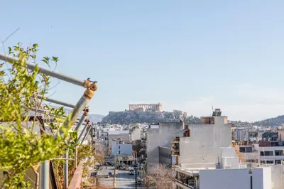 a view of a city with a hill in the background at Lucas apartment 3 in Athens