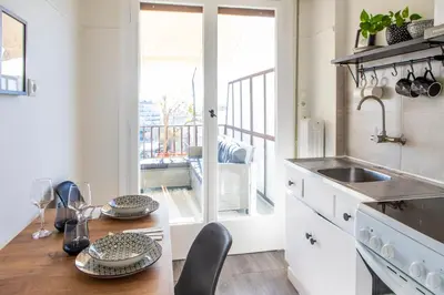 a kitchen with a table with plates on it at Lucas apartment 3 in Athens