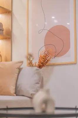 a living room with a couch and a painting at Acropolis View Dream Penthouse in Athens