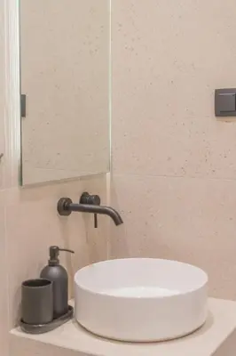 a white sink in a bathroom with a mirror at Acropolis View Dream Penthouse in Athens