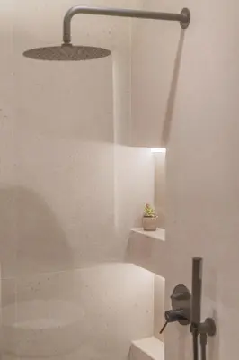 a bathroom with a bath tub and a potted plant at Acropolis View Dream Penthouse in Athens
