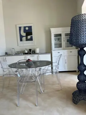 a dining room with a glass table and chairs at Acropolis View-Themelio Suite - Acropolis Area in Athens