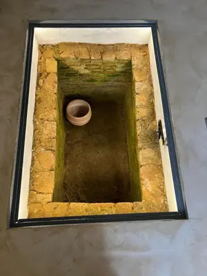 a hole in a stone wall with a bowl in it at Two-bedrooms Suite - Themelio Suites - Acropolis Area in Athens