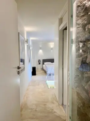 a hallway with a room with a bed and a door at Two-bedrooms Suite - Themelio Suites - Acropolis Area in Athens