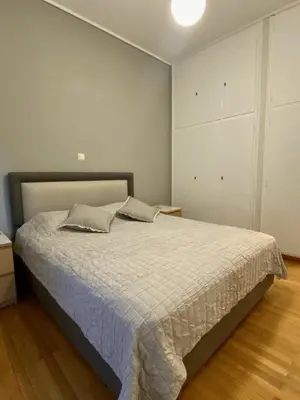 a bedroom with a large bed in a room at In between Syntagma & Plaka in Athens