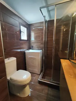 a bathroom with a toilet and a shower at Thissio Central - Pedestrian path in Athens