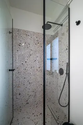 a shower with a glass door in a room at Athens Panorama Penthouse by Acropolis in Athens