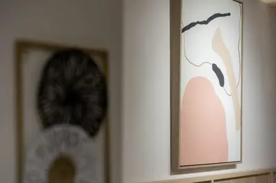 a picture on a wall with a picture on it at Vouliagmeni Square Resort in Athens
