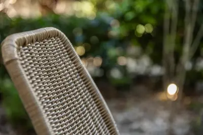 a close up of a brown chair in a park at Vouliagmeni Square Resort in Athens