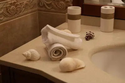 a bathroom sink with a roll of toilet paper on it at STONE of KAMARIZA in Áyios Konstandínos