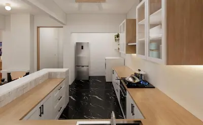 a kitchen with white cabinets and a stainless steel refrigerator at The Acropolis Penthouse in Athens