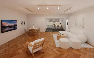 a living room with a white couch and a table at The Acropolis Penthouse in Athens