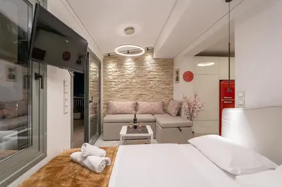 a small room with a bed and a couch at Gkizi View in Athens