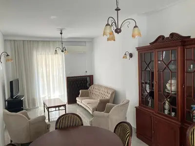 a living room with a couch and chairs and a table at Giorgio in Piraeus