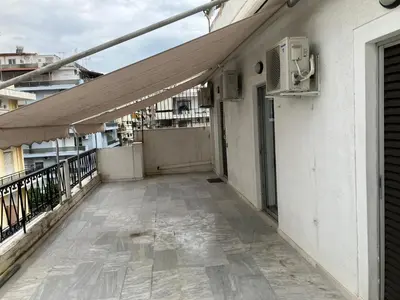 an empty balcony of a building with an open door at Giorgio in Piraeus