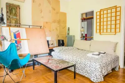 a living room with a couch and a table at Spacious Apartment near Parthenon in Athens