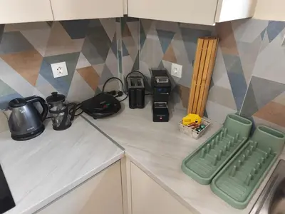 a kitchen counter with a keyboard and a coffee maker at Acropolis Sweet House 6 in Athens