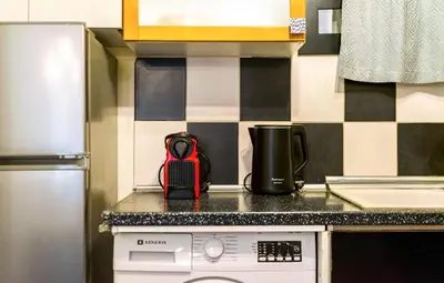 a kitchen with a counter top with a appliance on it at Magic Moments Near The Acropolis in Athens