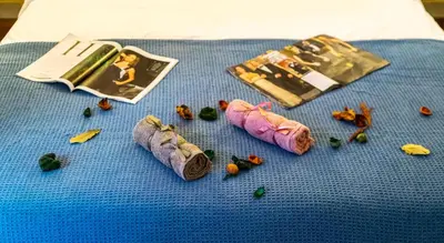 a blue table with sushi and a magazine and vegetables at Magic Moments Near The Acropolis in Athens