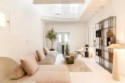 a living room with a couch and a table at Plaka Villa with Epic Acropolis Views in Athens