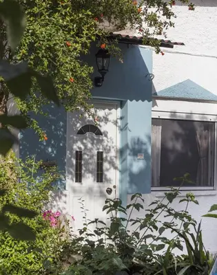 a blue and white front door of a house at Green Dome Escape in Athens