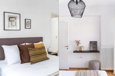 a bedroom with white walls and a bed with pillows at Elevated 2BR Apartment in Chalandri by UPSTREET in Athens