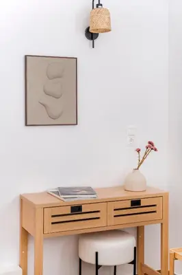 a wooden desk with two chairs and a picture on the wall at Elevated 2BR Apartment in Chalandri by UPSTREET in Athens