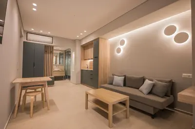 a living room with a couch and a table at Millennial Apartments Athens in Athens