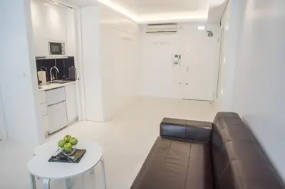 a living room with a couch and a table at Millennial Apartments Voulis in Athens