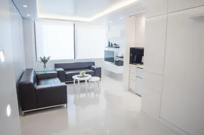 a living room with a couch and a table at Millennial Apartments Voulis in Athens