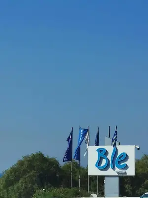 a big sign in front of some flags at Andy's sweet house in Athens