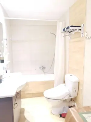 a bathroom with a toilet and a sink and a shower at Andy's sweet house in Athens