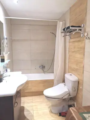 a bathroom with a toilet and a sink and a shower at Andy's sweet house in Athens