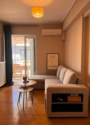 a living room with a couch and a table at Βένερε in Athens