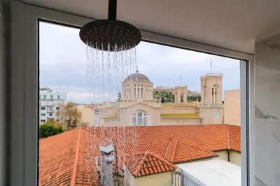 a window with a view of a building at ABOV Acropolis in Athens