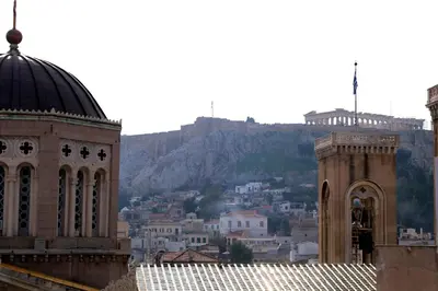 a church and a building with a mountain in the background at ABOV Acropolis in Athens