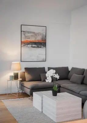 a living room with a couch and a coffee table at Glyfada Experience Residence in Athens
