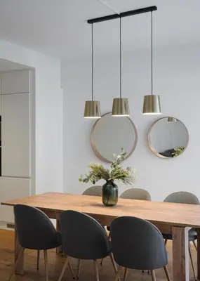 a dining room with a wooden table and chairs at Glyfada Experience Residence in Athens