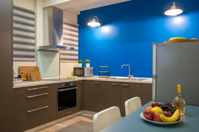a kitchen with a bowl of fruit on a table at Mia Homes - National Museum in Athens