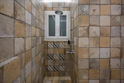 a bathroom with a shower with a window at Mia Homes - National Museum in Athens