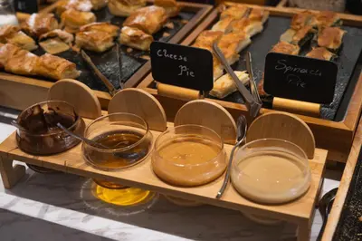 a display of different types of bread and pastries at Eternity Athens in Athens