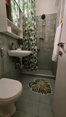 a bathroom with a toilet and a sink and a shower at ATHENS O'GERA escape in Athens